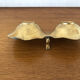 Empty pockets in brass and floral decoration