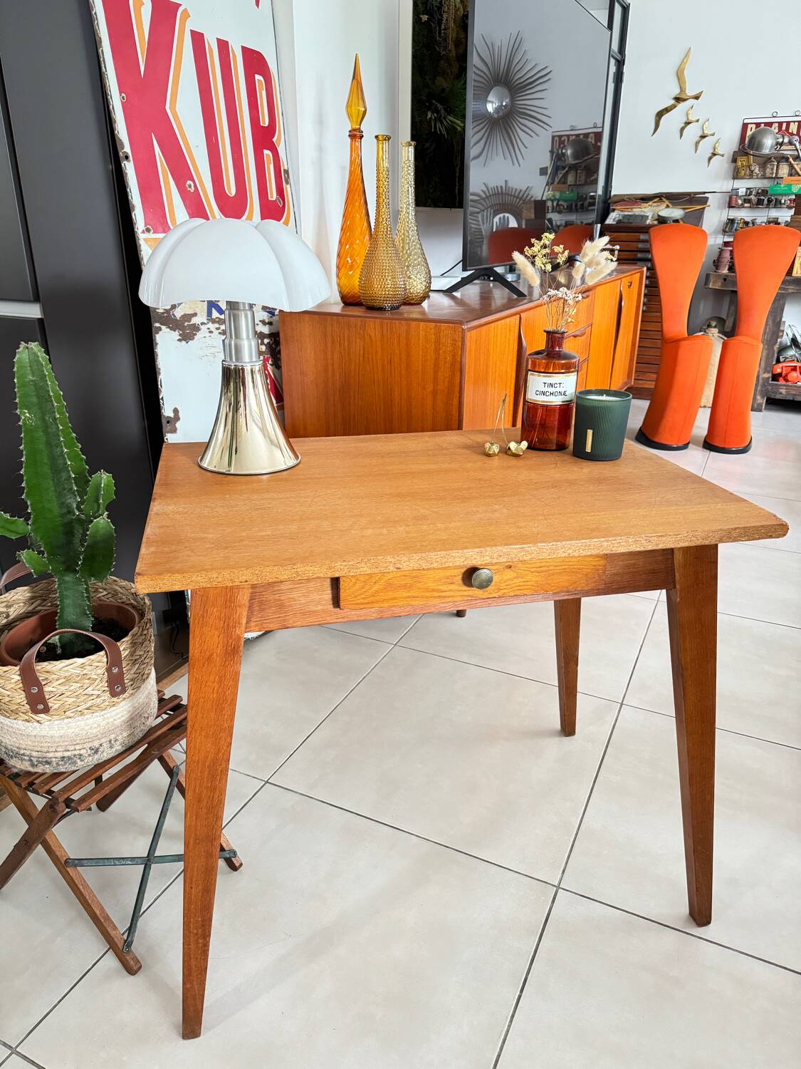Old wooden desk or side table with compass legs