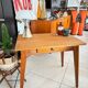 Old wooden desk or side table with compass legs