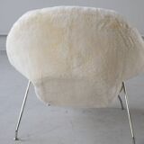 Womb Chair and Ottoman in fluffy white fabric by Eero Saarinen