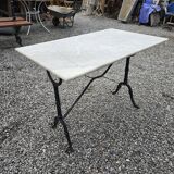 Bistro table with marble top and cast iron base