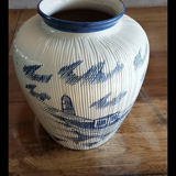 Large terracotta vase covered with ceramics