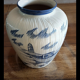 Large terracotta vase covered with ceramics