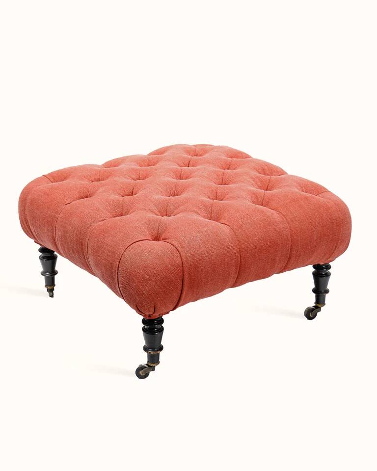 Napoleon III salon armchair in brick red linen with a tufted footrest.