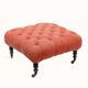 Napoleon III salon armchair in brick red linen with a tufted footrest.