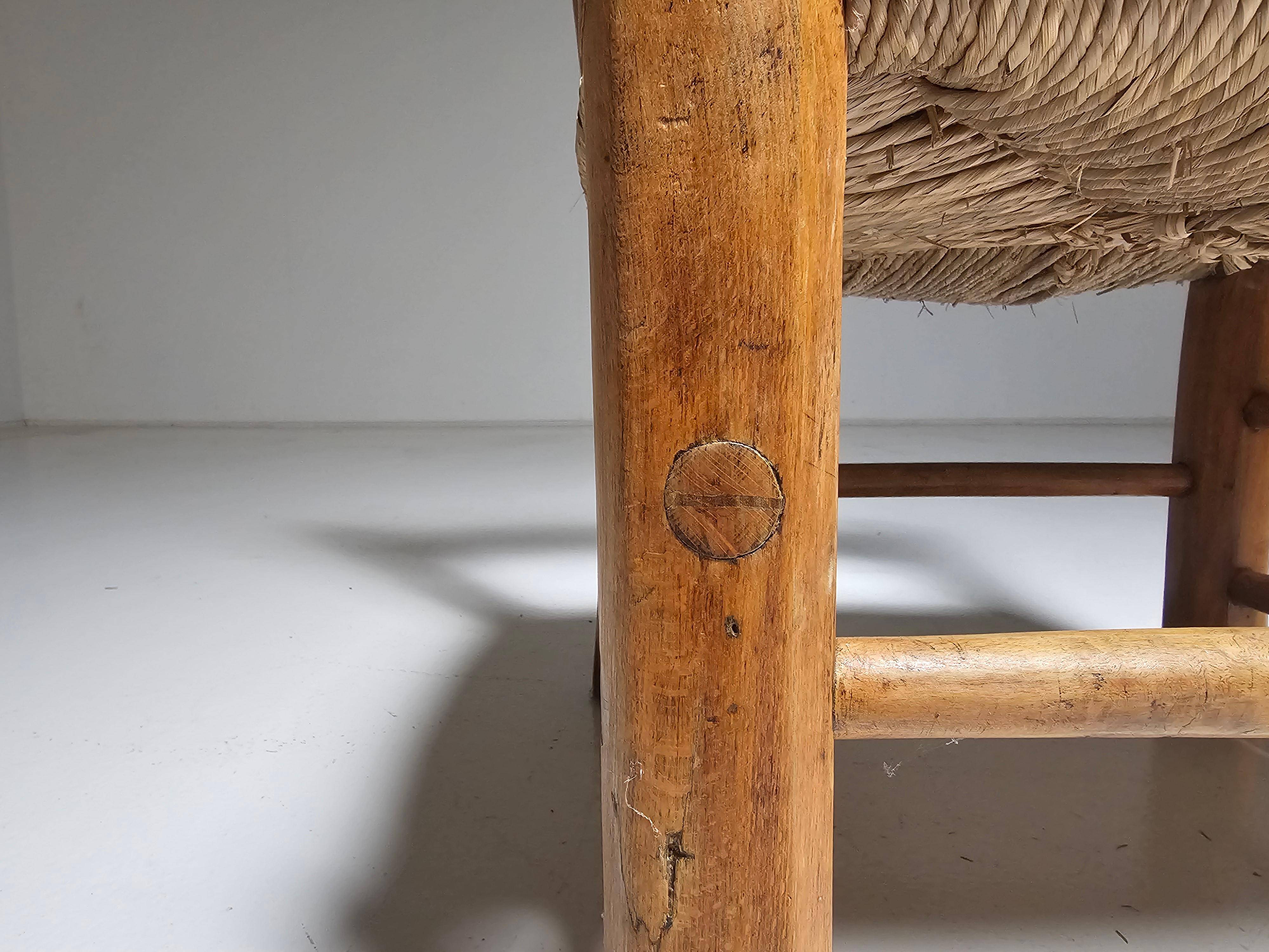 Pair of rustic French low chairs made of elm wood and straw, 1960s.