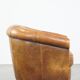 Cognac-colored sheep leather club chair with patina