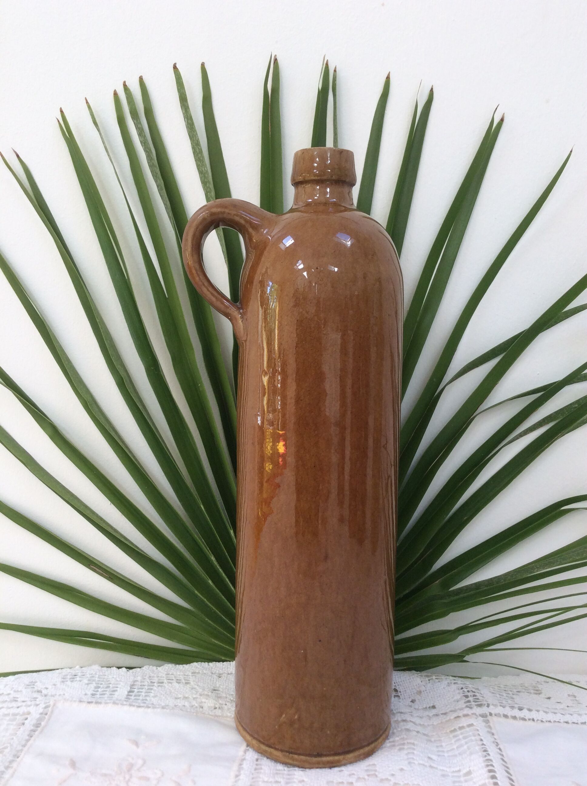 Old bottle in sandstone glossy with cove