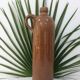 Old bottle in sandstone glossy with cove