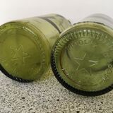 Two 6 star green bottles