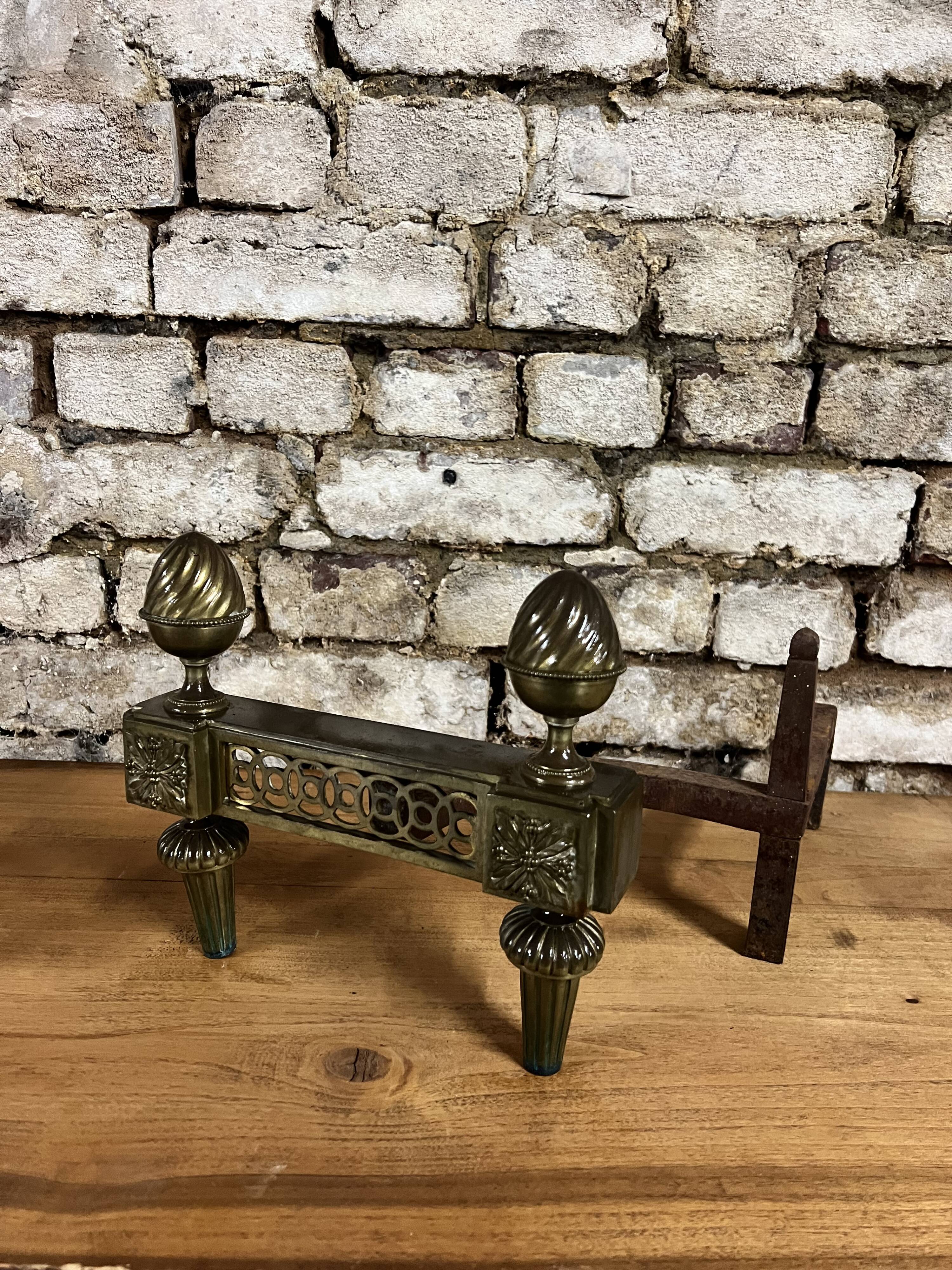 Pair of bronze andirons stamped bouhon frères in louis xvi style