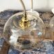 Set of three new electrified golden glass pendant lamps