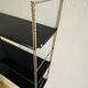 Adjustable vintage wall shelf in black metal and brass