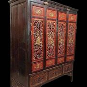 China 19th century: Red lacquer cabinet with gilding from the Qing Dynasty.
