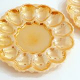 Pair of iridescent orange glass egg plates