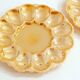 Pair of iridescent orange glass egg plates