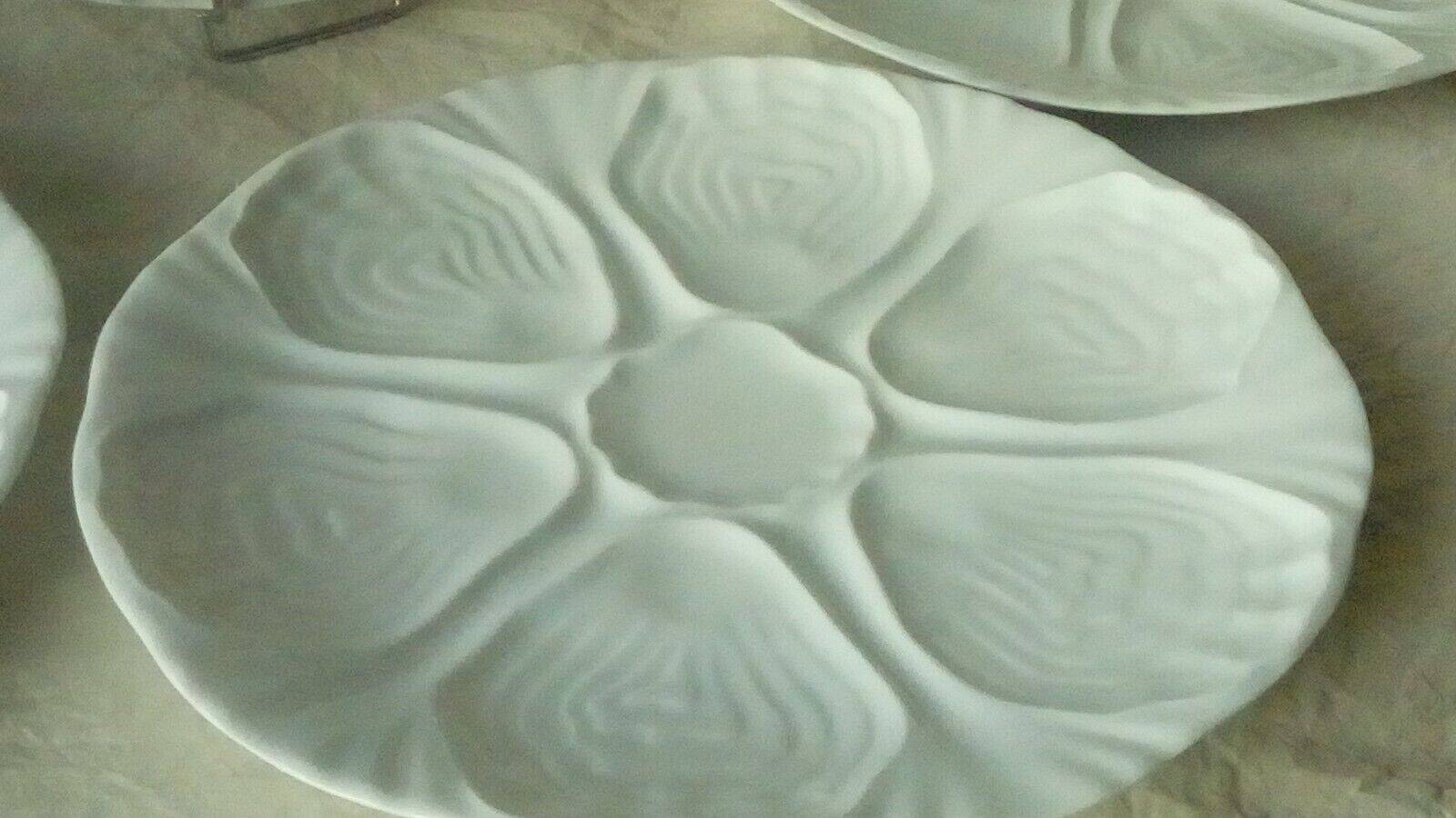 White porcelain oyster plates
