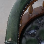 Dark green cowhide leather and wood chesterfield office chair on wheels