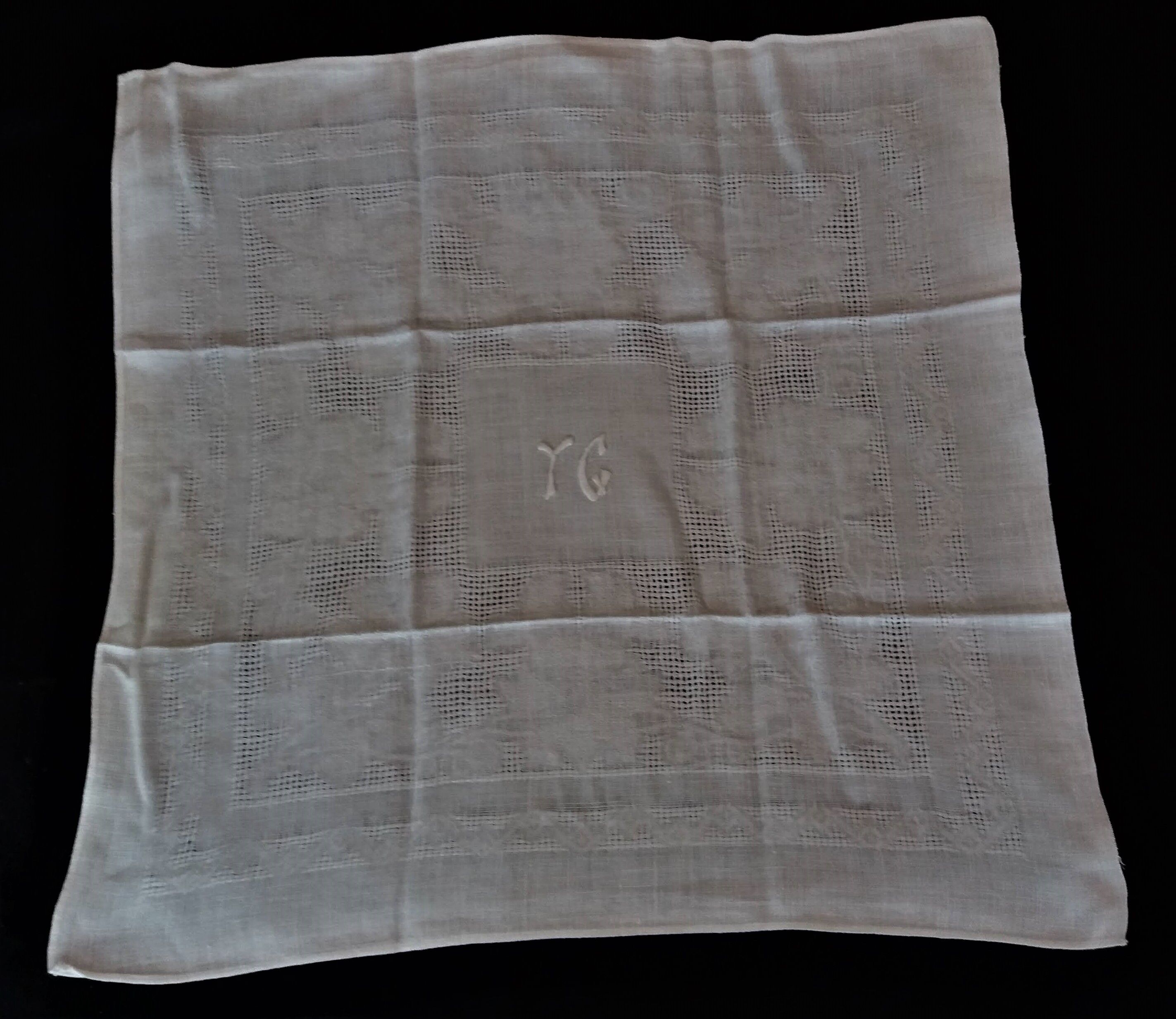 Series of six hand embroidered YG monogrammed YG linen table towels