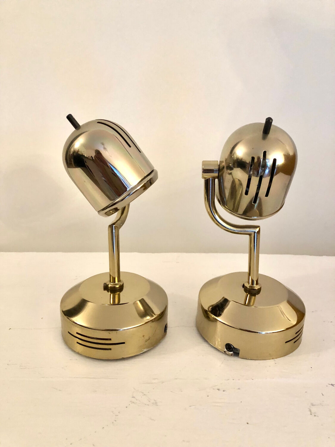 Vintage Fase adjustable wall lights in gold metal.