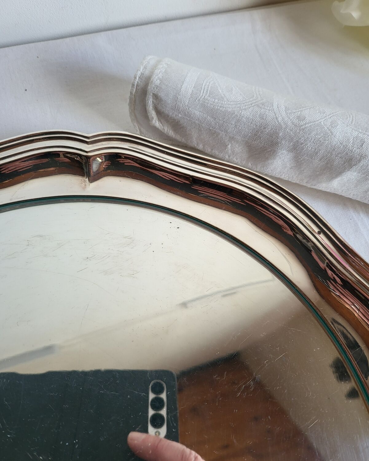 Round silver-plated serving dish with a glass base.