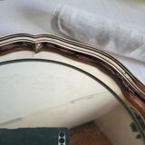 Round silver-plated serving dish with a glass base.