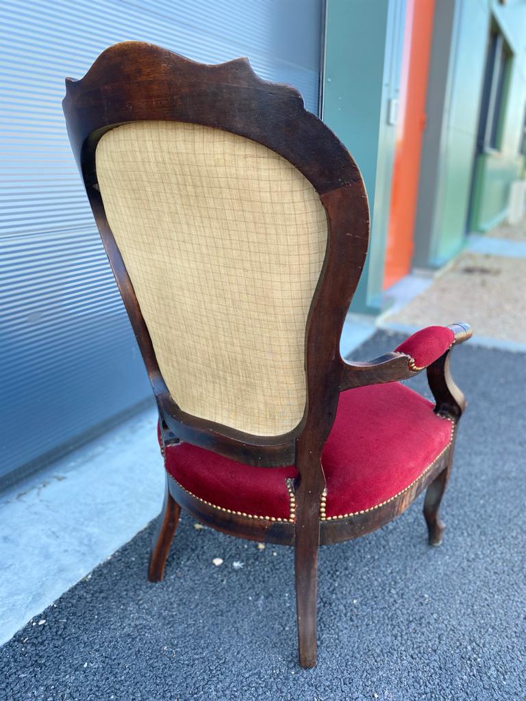 Fauteuil voltaire en velours rouge