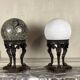 Pair of marble spheres on bronze tripods, 19th century
