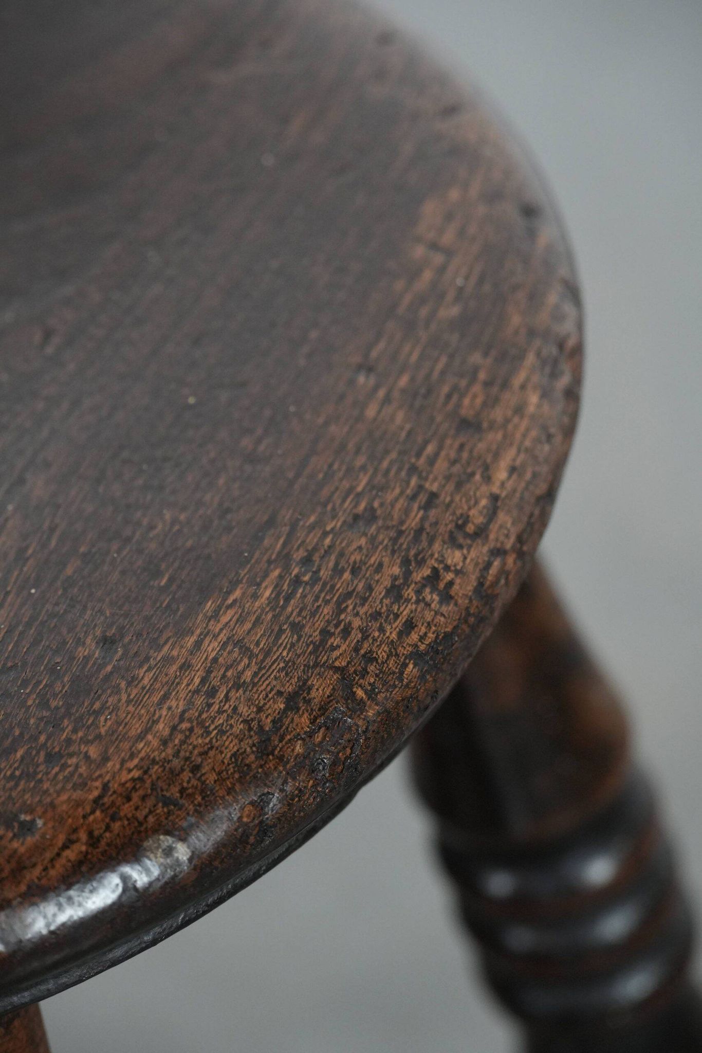 Antique English Windsor stool from the 18th century with a great patina