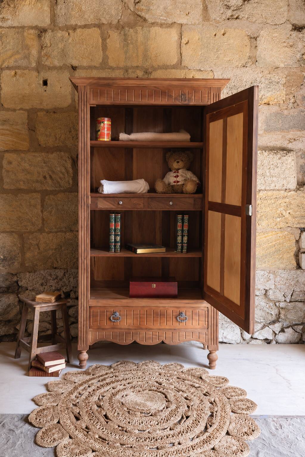 Antique walnut bonnetière with bevelled mirror.