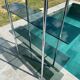 Bauhaus style bookcase with modular wall shelf, glass and chrome
