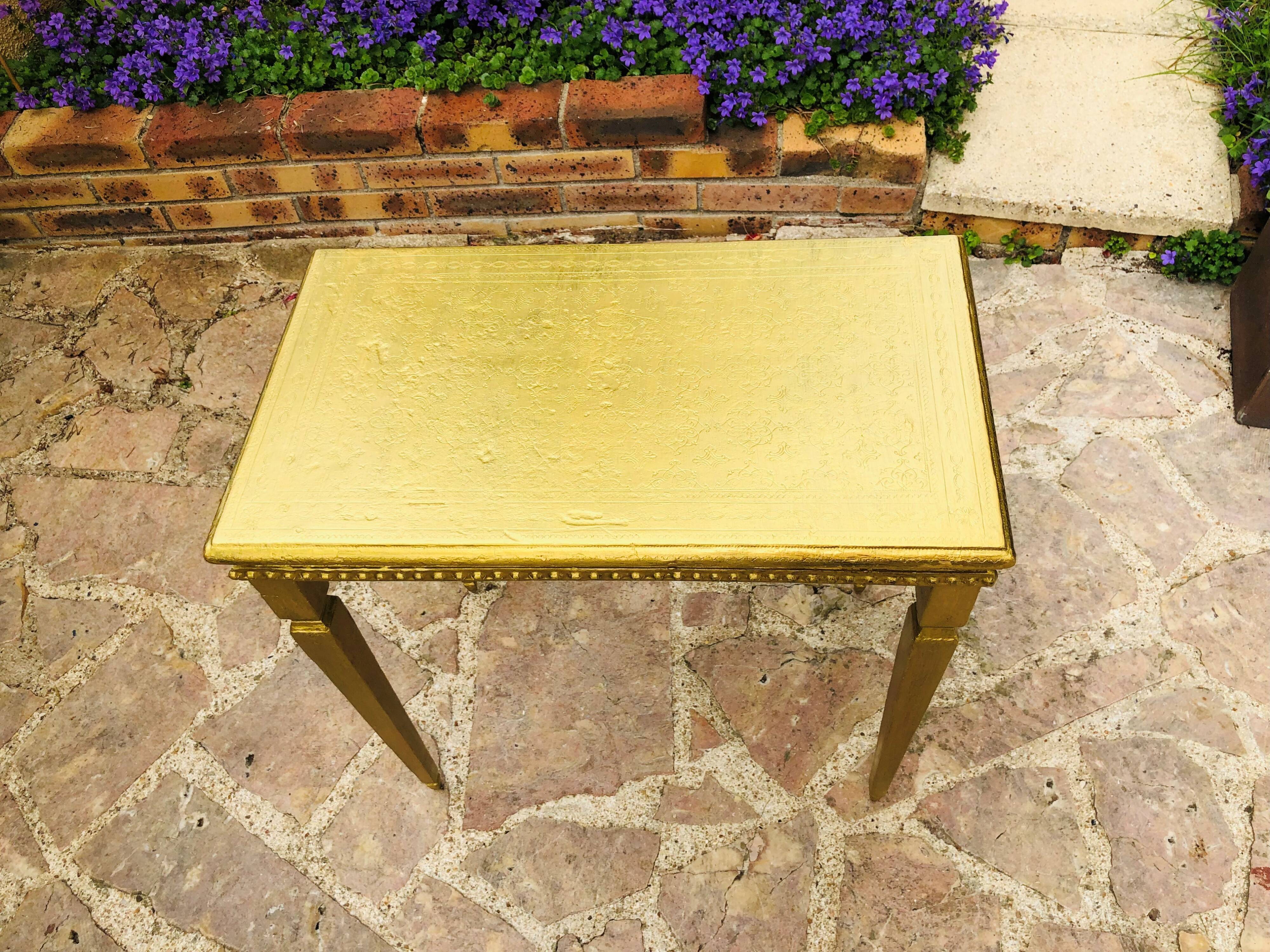 Coffee table in gilded wood
