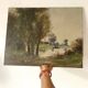 Old canvas painting at the water's edge, boat