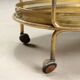 Vintage double-tier brass serving trolley, 1950s design.
