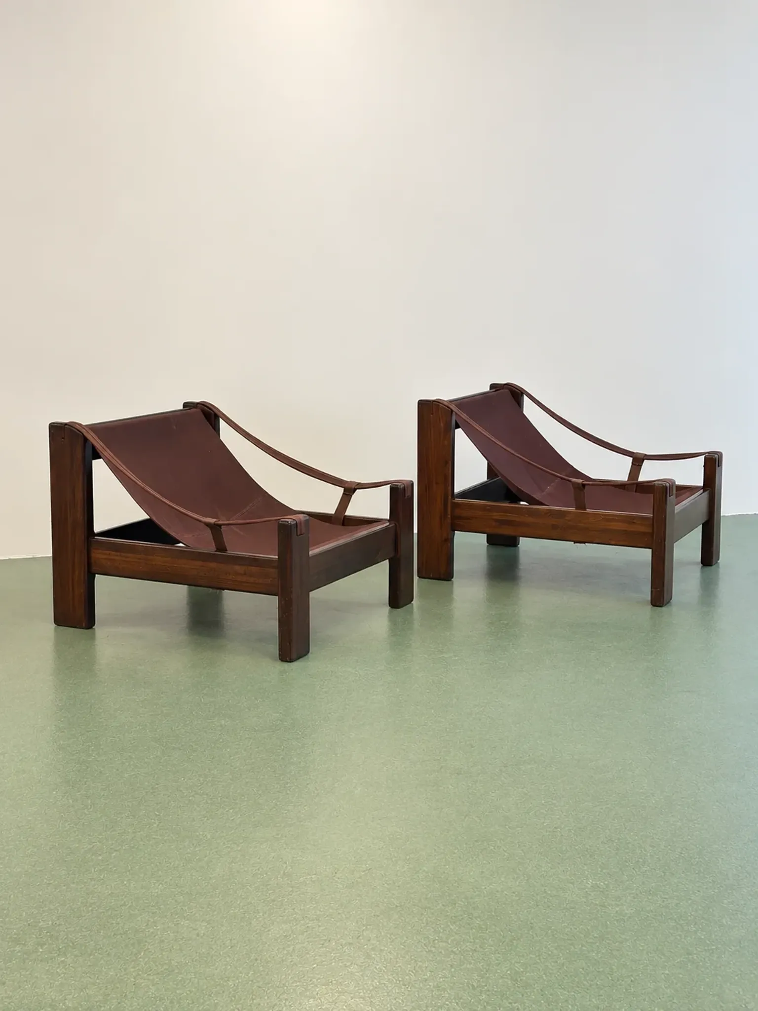 Pair of brutalist leather lounge chairs, 1960s