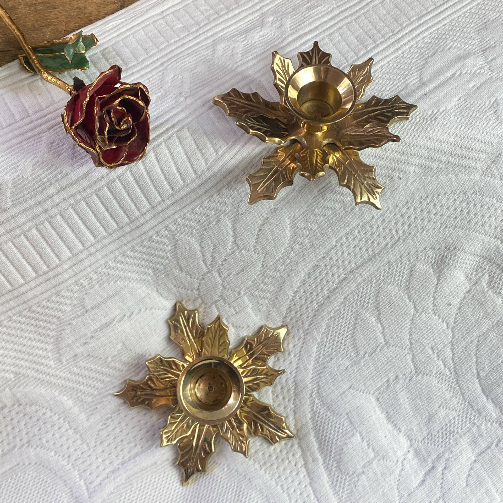 Pair of candlesticks, holly leaves, in brass