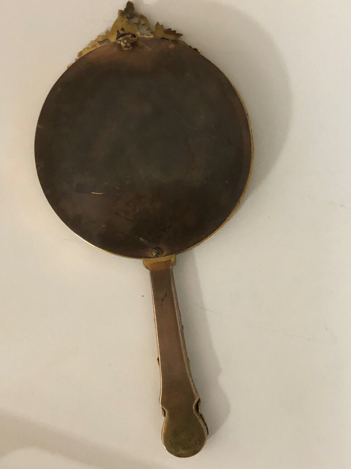 Hand mirror in gilded bronze