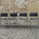 Four vintage chairs from the 1960s and 1970s, chrome with faux leather.