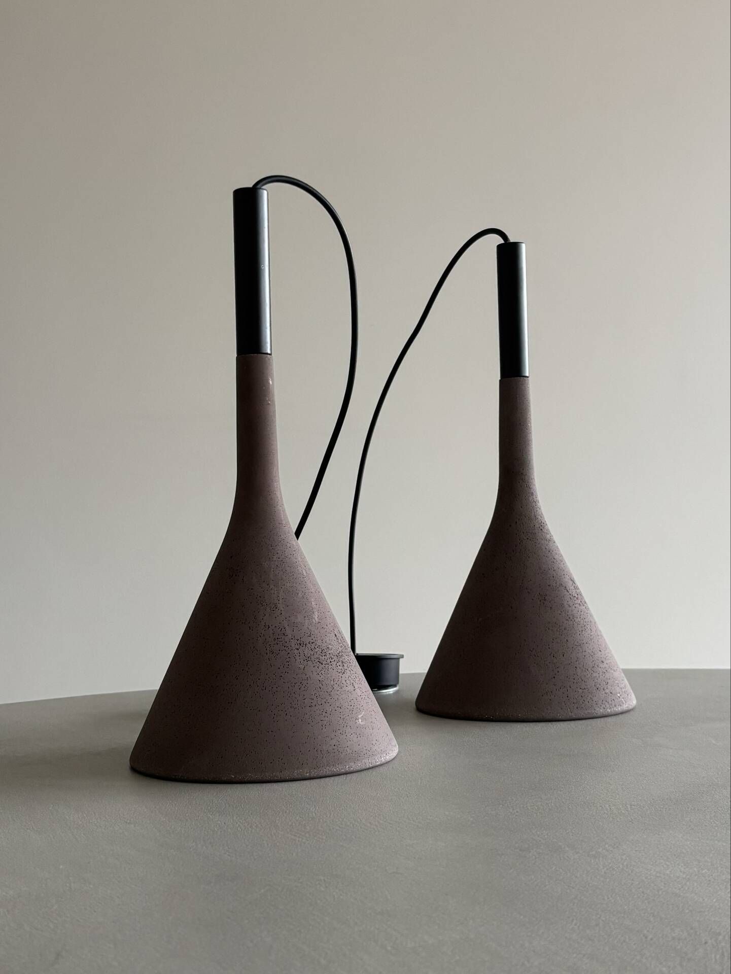 A pair of Aplomb concrete pendants by Lucidi & Pevere for Foscari.