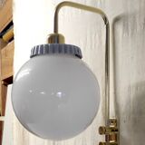 Opaline glass globe wall sconce with a gilt metal bracket - mid-20th century