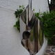 Hanging space age stainless steel