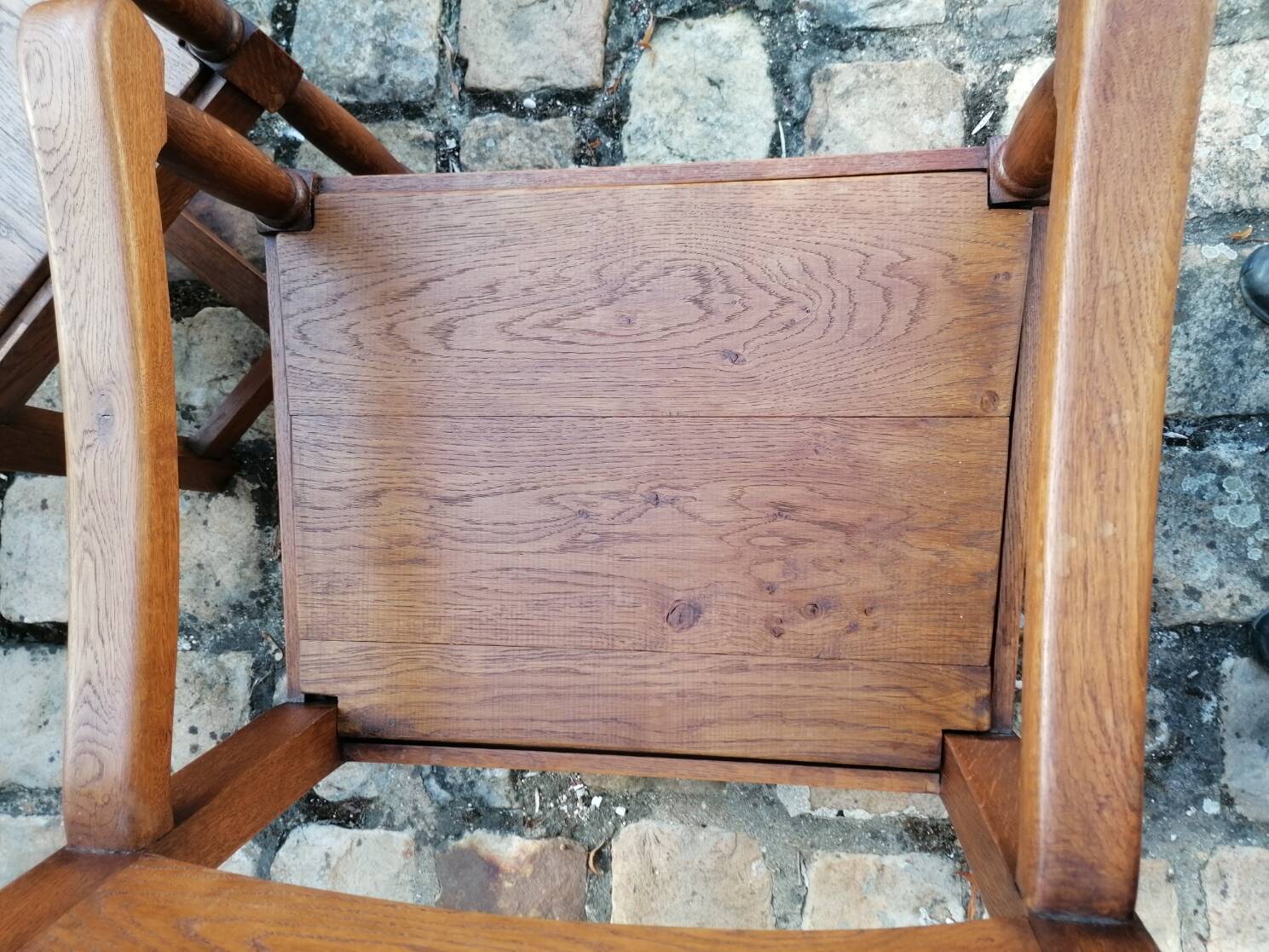 Pair of vintage oak armchairs with geometric design.