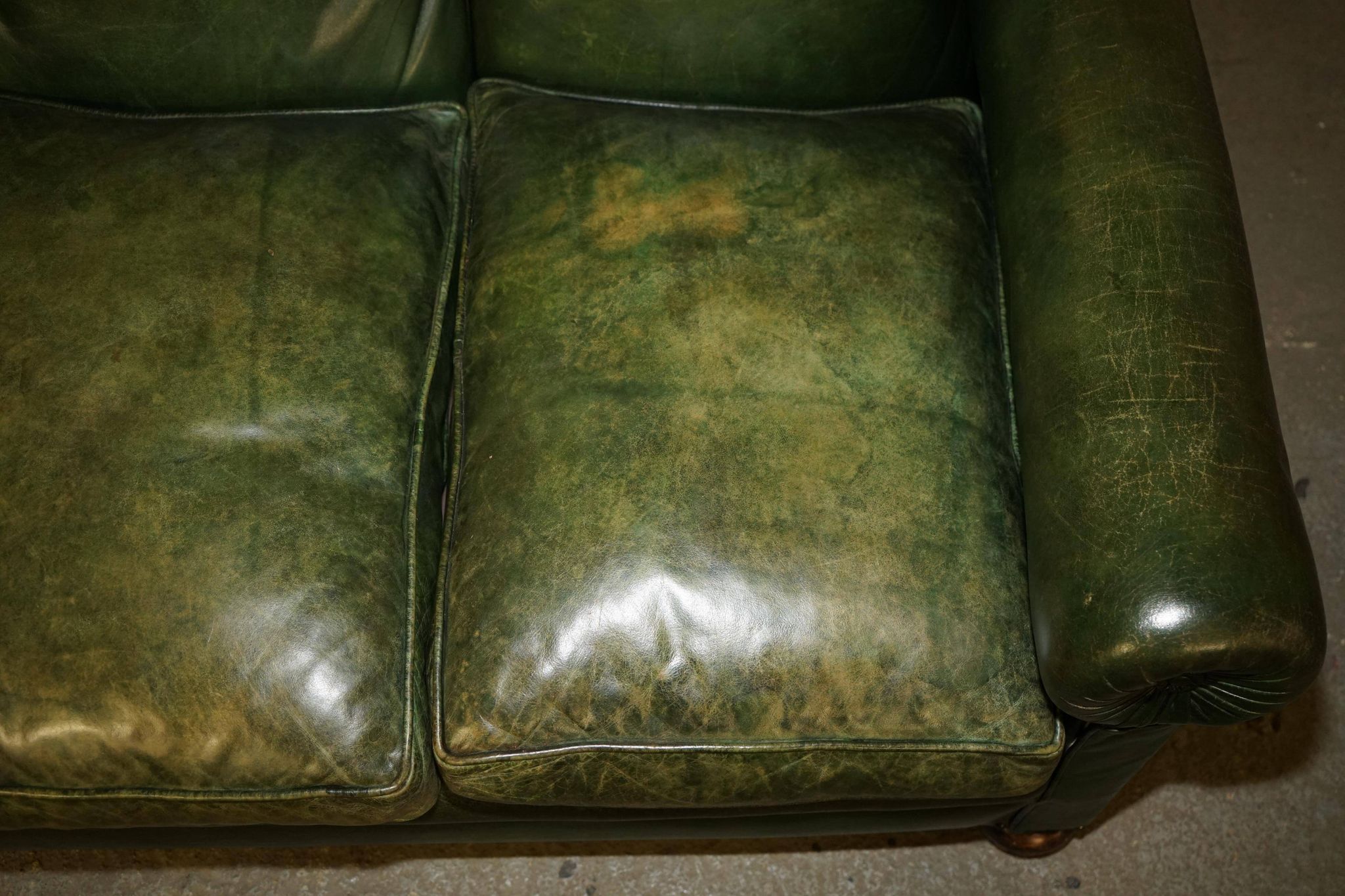 Victorian leather canapé, shield armrests, stamped Maple & Co.