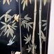 Chinese lacquered screen with decorations of birds and bamboo. Chinese work. Around 1950.