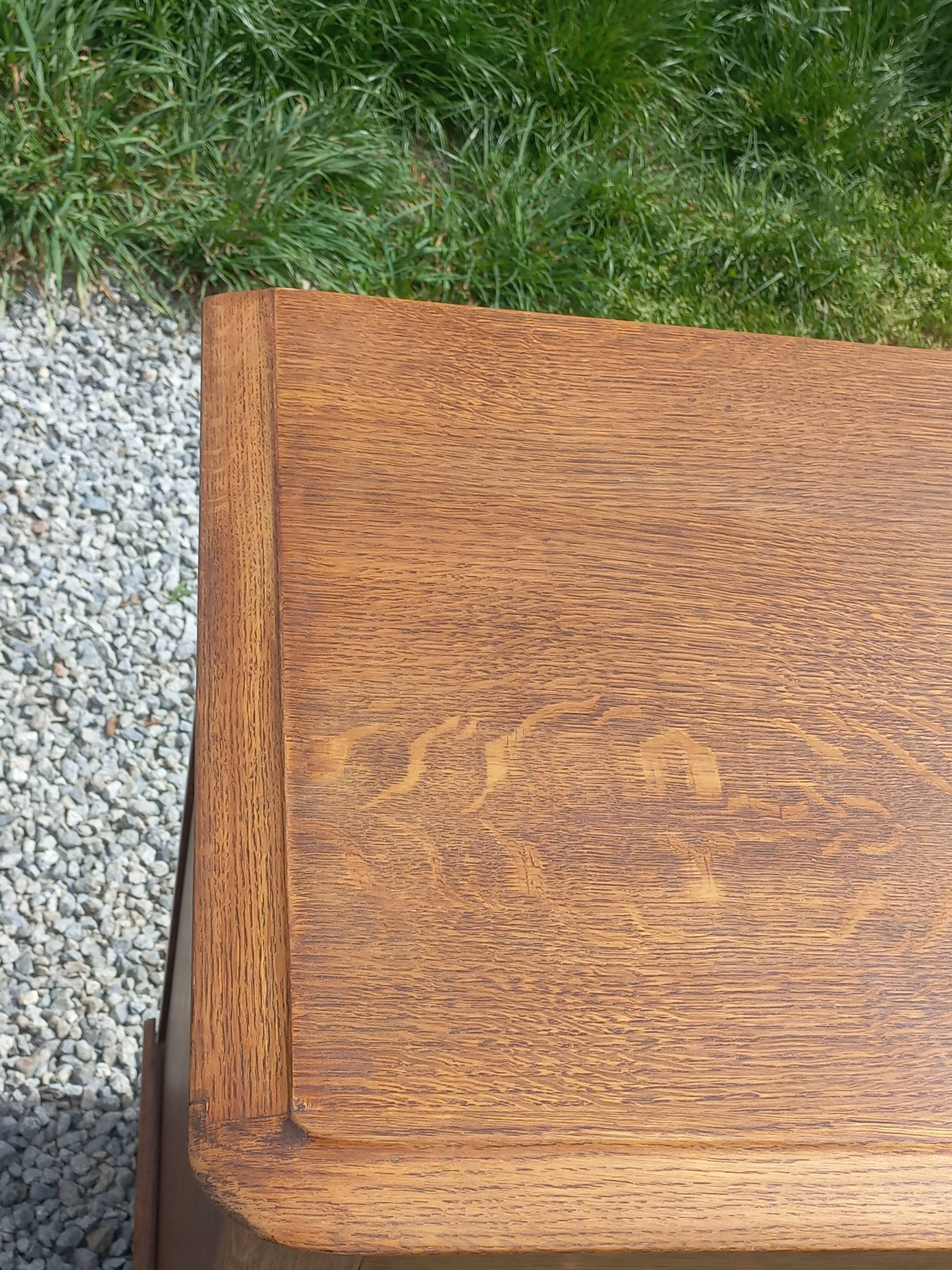 Vintage oak commode with tapered legs from the 1950s.
