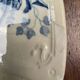 Old Gien plate with carved edges featuring doves and blue flowers, circa 1920-1930.