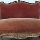 Louis XV style salon in carved walnut with orange velvet, seven pieces.