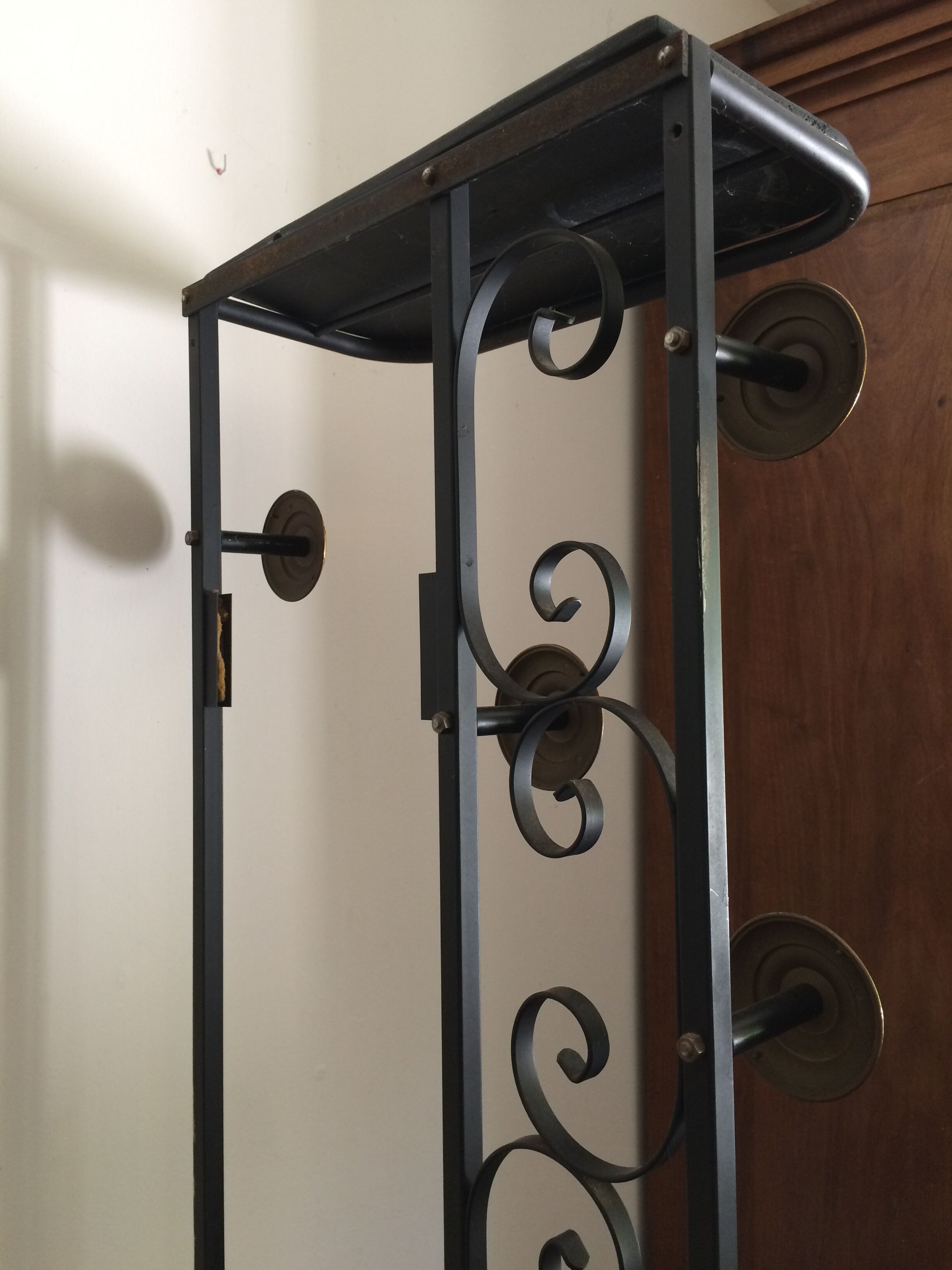 Coat hanger on wrought iron feet
