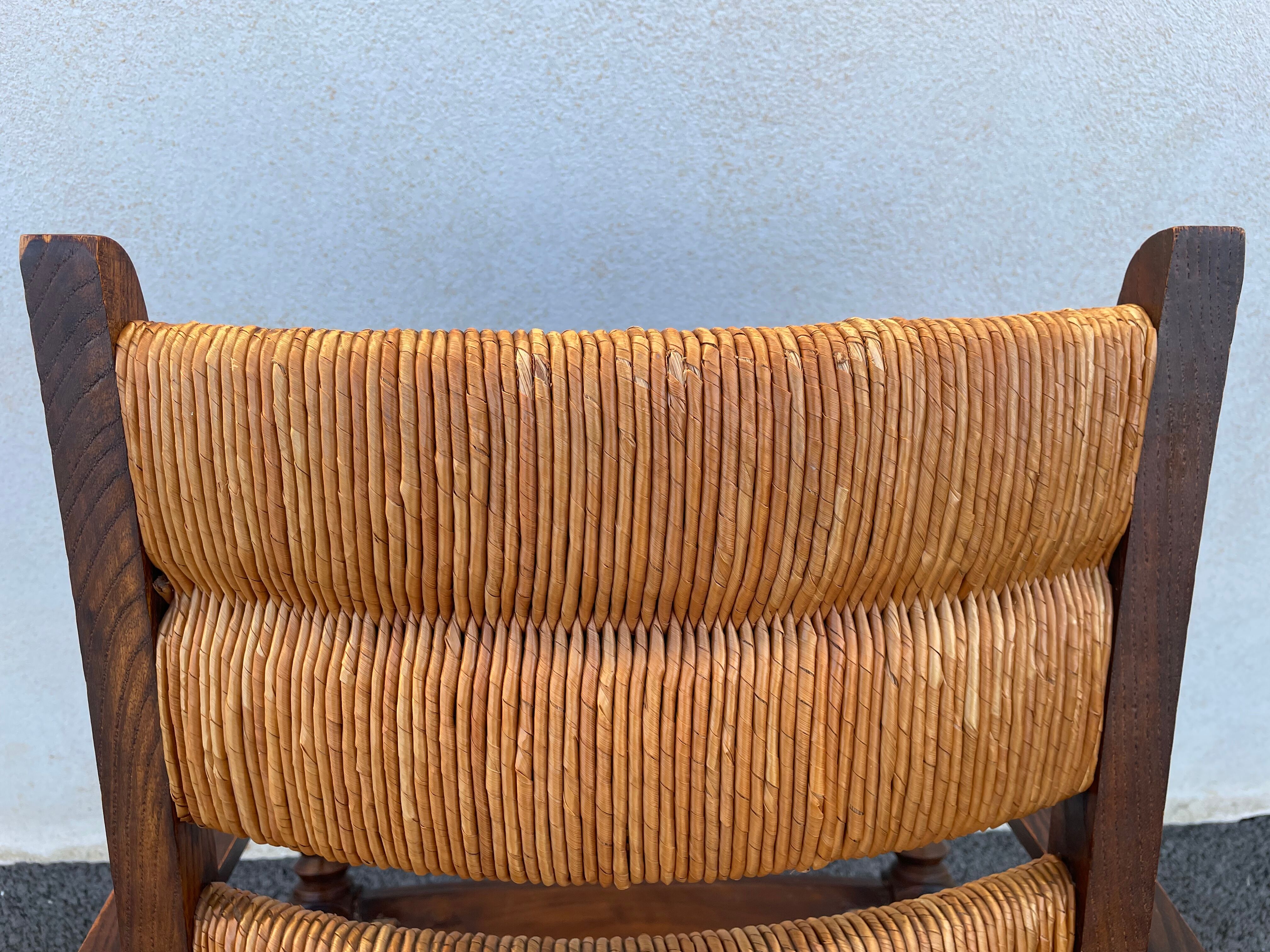 Vintage armchair in straw and brutalist wood