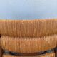 Vintage armchair in straw and brutalist wood
